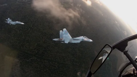 Fighters maneuver in the group Stock Footage 100374352