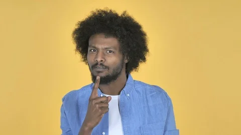 Fighting Angry Afro-American Man on Yellow Background Video stock 99220165