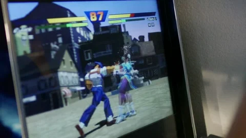 Fighting Arcade Game on Screen, Two Characters Battling, Angled Close Up Stock-Footage 341452323