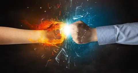 Fighting hands breaking glass with fire and water Foto stock