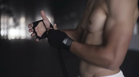 Fighting preparation fighter wrapping his hands Stock Footage 64055875