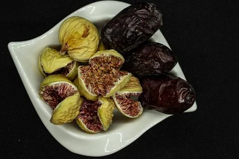 Figs and Dates on ceramic white bowl 스톡 사진