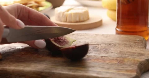 Figs are cut on a cutting board. Stock Footage 249596970