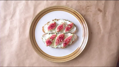 Figs on bread slice with cream cheese spread Stock Footage 76198146