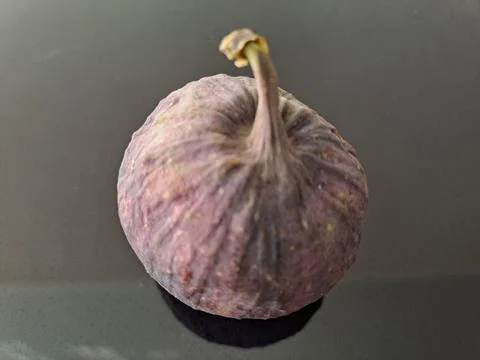 Figs on a dark mirrored surface Stock Photos