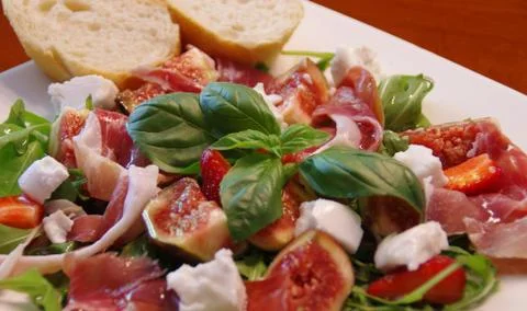 Figs with ham and rucola Stock Photos
