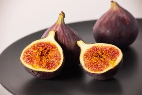 Figs on a plate, figs in section Stock Photos