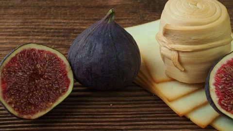 Figs, various cheese on a rustic table. Stock Footage 212351235