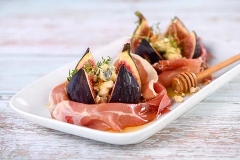 Figs wrapped in Parma ham Stock Photos