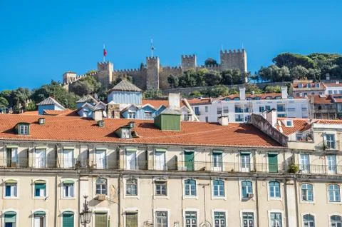 Figueira square (or praca da figueira) in lisbon, portugal. view of castle. Stock Photos