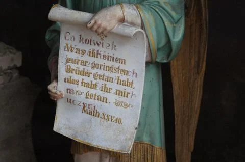 Figure of an angel holding a scroll Stock Photos