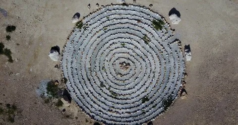 Figure of a circle from stone made on the ground. Drone Point of View Stock Footage 74565392