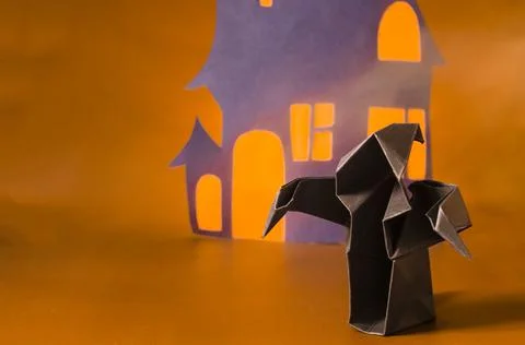 The figure of a dark ghost against the background of a black house . Stock Photos