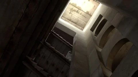 Figure draped in white sheet peers from upper level of decrepit stairwell Stock Footage 320247328