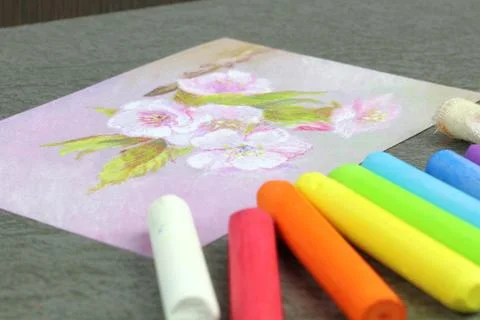 Figure drawn by wax crayons. Technique pastel. Multicolored crayons and a pictur Stock Photos