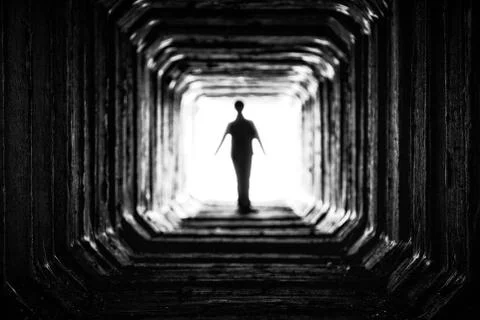 Figure at the end of the tunnel Foto stock