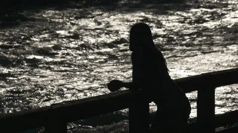 Figure of a girl on a background of the river flow Video stock 66786162