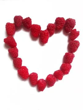 Figure of heart made from raspberry on a white background Stock Photos