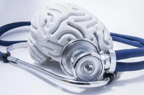 The figure of the human brain with a stethoscope or phonendoscope around him Stock Photos