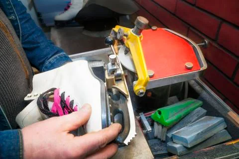 Figure ice skate getting sharpened Stock Photos