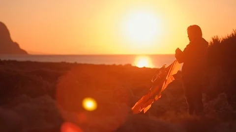 The figure launches a kite Stock Footage 97795531