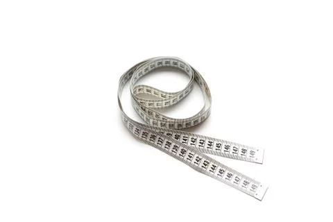The figure is loop of a centimeter tape. Isolate measuring tape on a white Stock Photos