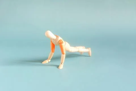 The figure of a man doing a physical exercise doing push-ups from the floor Stock Photos