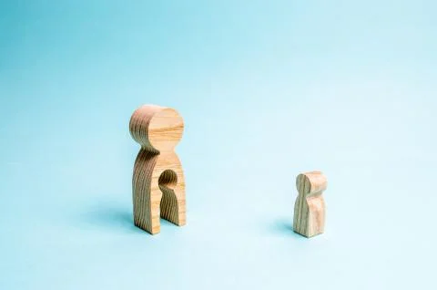 Figure of a man with an empty form in the form of a child and a child. Concep Stock Photos