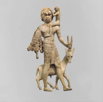 Figure of a man with an oryx, a monkey, and a leopard skin ca. 8th century .. Stock Photos