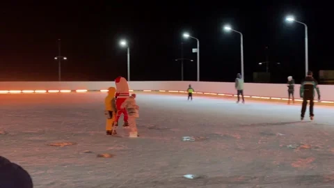 Figure skater performs stunts on ice skates, skating on ice rink, illumination Stock Footage 172139166