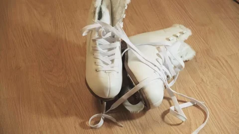 Figure skates, lying on the floor, figure skates are taken on a trip Stock Footage 264093353