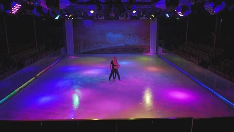Figure skating couple performs dance on rehearsal with spin, jump, turn elements Stock Footage 137455969
