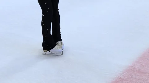 Figure skating lesson. Figure skaters training at the rink. Professional sports. Stockbeeldmateriaal 330674541