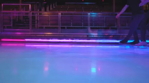 Figure skating slide element on ice rink with skaters legs Stock Footage 137466746