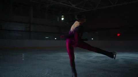 Figure Skating In Slow Motion, Beautiful Woman Skating Alone On Ice Rink In Stock Footage 253597773