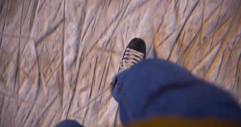 Figure skating. Top view on a man who skates in the black skates on the clean Stock Footage 145097672