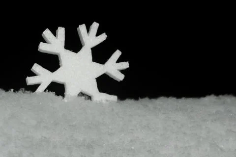 Figure snowflakes in the snow Stock Photos