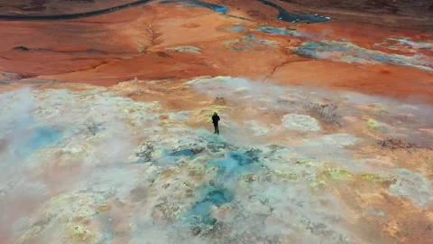 Figure Standing In Steaming Volcanic Terrain Of Myvatn Stock Footage 156850342
