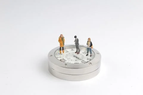 Figure standing on watch  time countdown concept. Foto stock