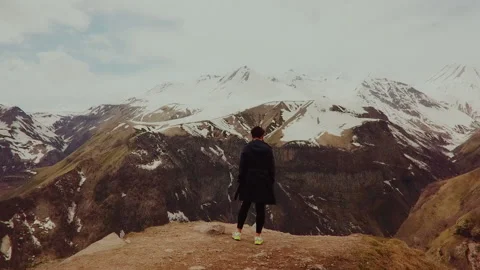 A figure on top in the middle of the mountains Stock Footage 172120710