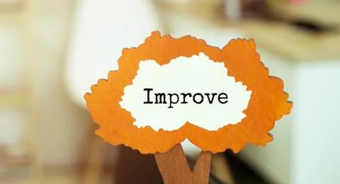 Figure of a tree with text improve inside the foliage. Business concept Stock Photos