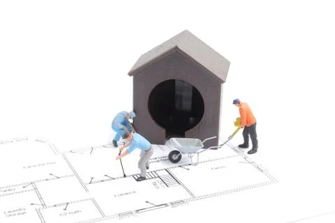 The figure of worker building house Fotos de archivo
