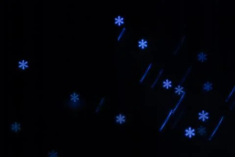 Figured boke in the form of a snowflake on a dark background. Stock Photos