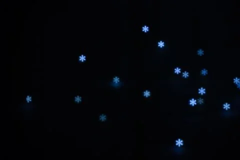 Figured boke in the form of a snowflake on a dark background. Stock Photos