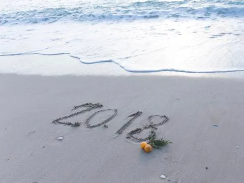 Figures 2018 on the sand Stock Photos