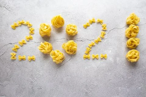 The figures 2021 from shells, bows are laid out from pasta Stock Photos