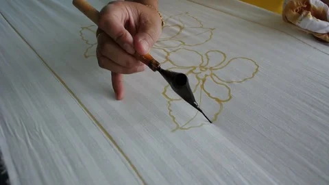 Figures on the batik. Stock Footage 79202120