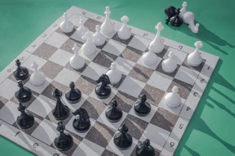 Figures on the chessboard. Stock Photos