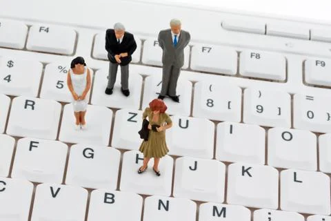 Figures on computer keyboard Stock Photos
