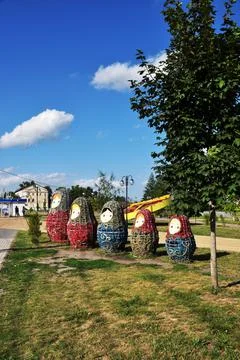 Figures of nesting dolls on the city square. Stock Photos